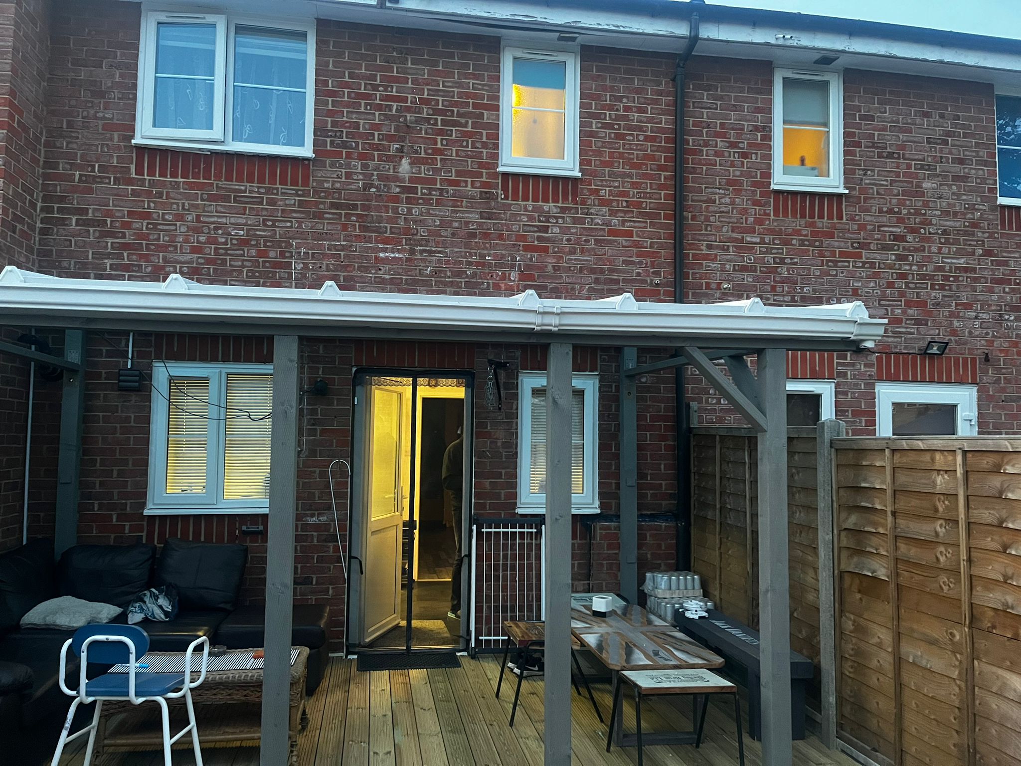 Completed rear house extension with covered terrace and outdoor seating area in South East London by KDB Home Solutions