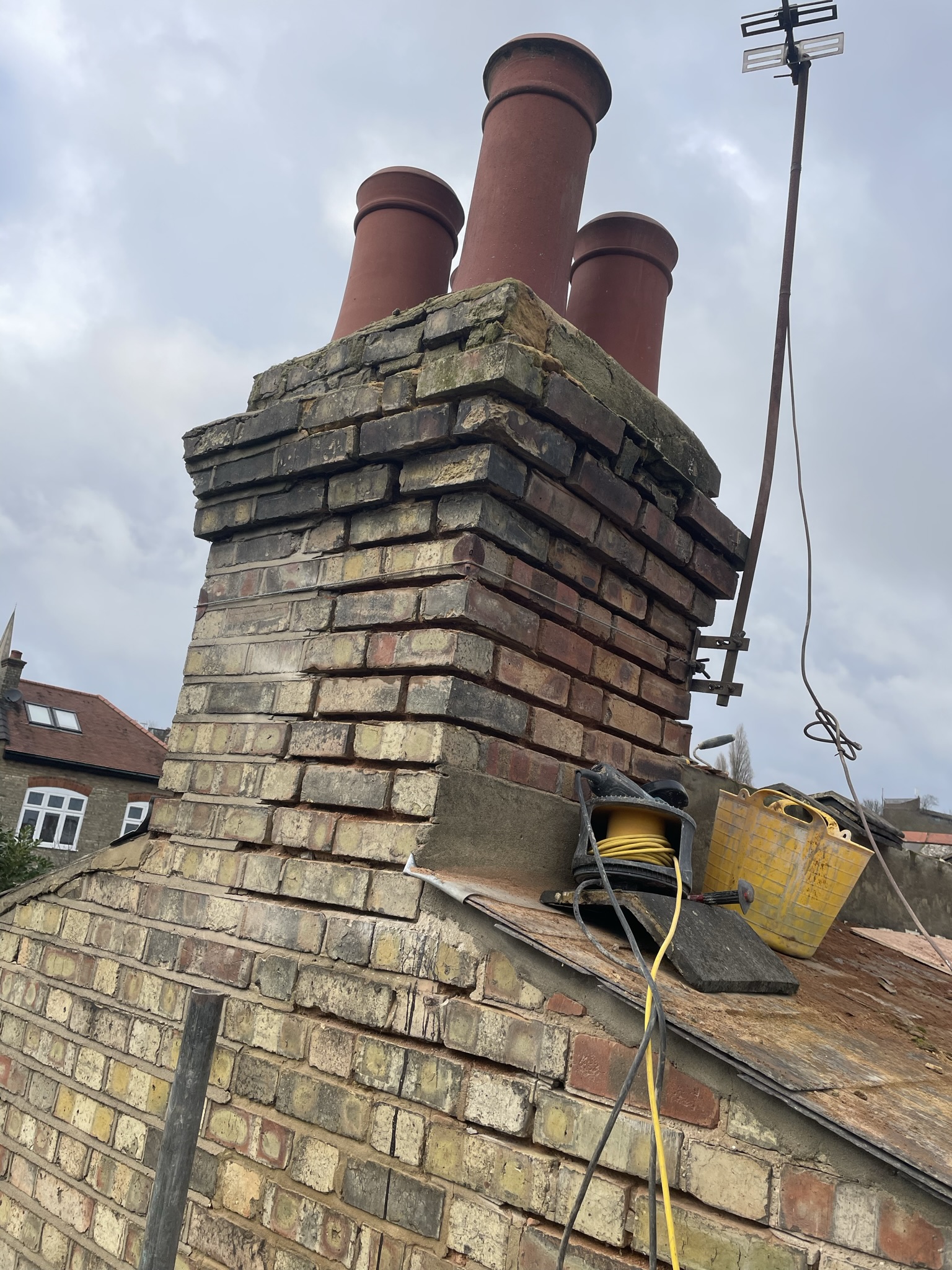 Completed chimney repointing and new terracotta chimney pots on London terraced house by KDB Home Solutions