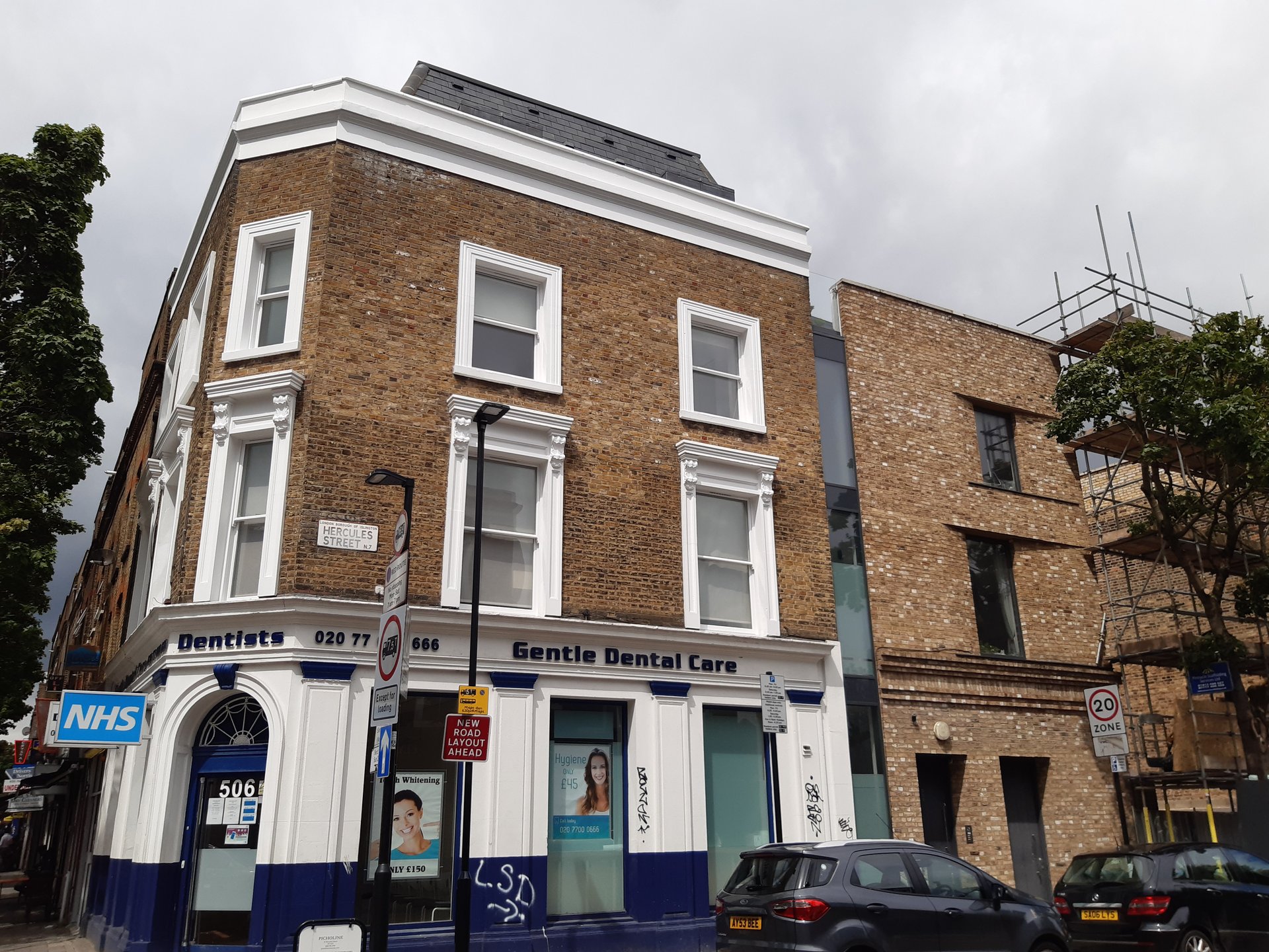 Completed new-build commercial extension in London, brick façade alongside Victorian terrace by KDB Home Solutions